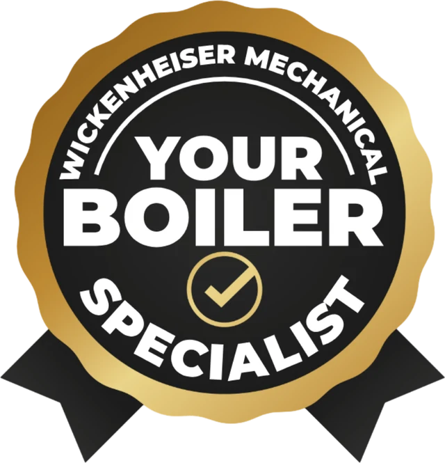 The Your Boiler Specialist badge: a gold-rimmed black seal reading Wickenheiser Mechanical, Your Boiler Specialist